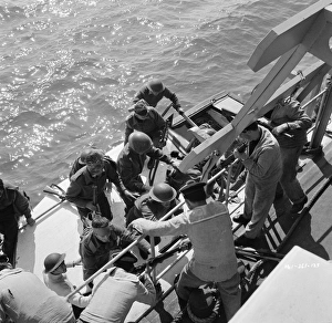 British soldiers board a Royal Navy ship