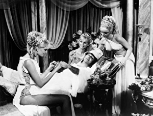 <b class=qtipBold><figcaption>Carry On Cleo (1964)</figcaption></b><br>Kenneth Connor as Hengist Pod enjoys a manicure by three Roman beauties.<br><em>© Copyright © Studiocanal Films Ltd</em> Carry On Cleo (1964)