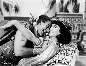 <b class=qtipBold><figcaption>Carry On Cleo (1964)</figcaption></b><br>Sid James as Mark Anthony and Amanda Barrie as Cleopatra.<br><em>© Copyright © Studiocanal Films Ltd</em> Carry On Cleo (1964)