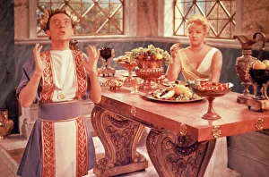 <b class=qtipBold><figcaption>Carry On Cleo (1964)</figcaption></b><br>Kenneth Williams as Julius Caesar and Joan Sims as Calpurnia in a scene from the Gerald Thomas' comedy classic.<br><em>© Copyright © Studiocanal Films Ltd</em> Carry On Cleo (1964)
