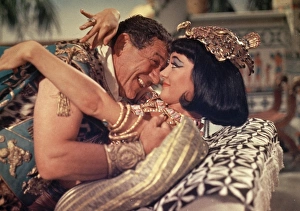 <b class=qtipBold><figcaption>Carry On Cleo (1964)</figcaption></b><br>Sid James as Mark Antony and Amanda Barrie as Cleopatra.<br><em>© Copyright © Studiocanal Films Ltd</em> Carry On Cleo (1964)