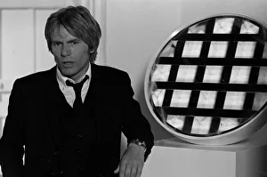 A close up of Adam Faith