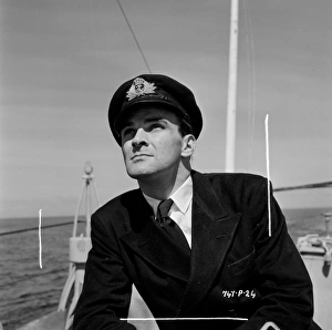 <b class=qtipBold><figcaption>The Cruel Sea (1953)</figcaption></b><br>A portrait of Stanley Baker on location.<br><em>© Copyright © Studiocanal Films Ltd</em> The Cruel Sea (1953)
