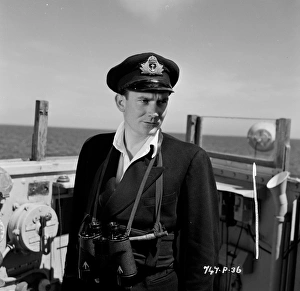 <b class=qtipBold><figcaption>The Cruel Sea (1953)</figcaption></b><br>A portrait of Denholm Elliott on location.<br><em>© Copyright © Studiocanal Films Ltd</em> The Cruel Sea (1953)