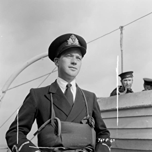 <b class=qtipBold><figcaption>The Cruel Sea (1953)</figcaption></b><br>A portrait of John Stratton on location.<br><em>© Copyright © Studiocanal Films Ltd</em> The Cruel Sea (1953)