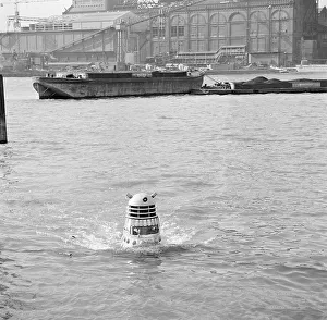 1960s Prints: A Dalek emerges from the river Thames at the jetty near Battersea Church Road