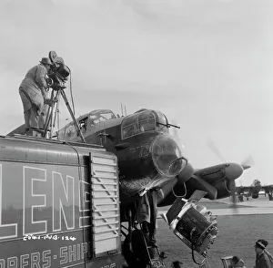 <b class=qtipBold><figcaption>The Dam Busters</figcaption></b><br>Filming on the set of The Dam Busters with one of the Lancaster planes in the background.<br><em>© Copyright © Studiocanal Films Ltd</em> The Dam Busters