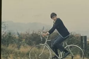 Countryside Collection: David Essex rides a bicycle