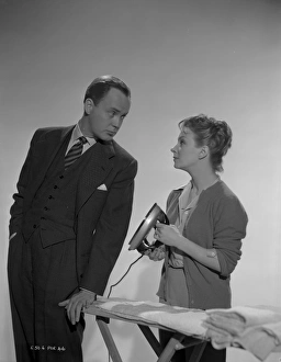 Derek Farr and Joan Greenwood pose in a publicity portrait for Young Wives Tale (1951)