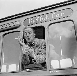 A drink by the window of the buffet car