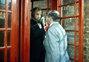 Images Dated 24th January 2018: Fred Midway tries to enter a phone box