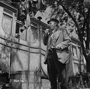 Hugh Griffith as Dan
