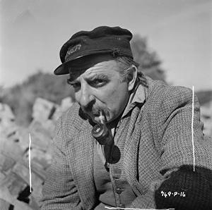 Hugh Griffith with pipe