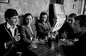 Interior Collection: Jim Maclaine with a soft drink and friends