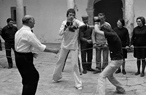 Jim and Mike boxing in the courtyard