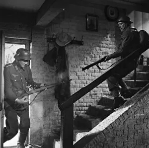 DUNKIRK (1958) Collection: John Mills as Corporal Bins in close combat with a German Soldier