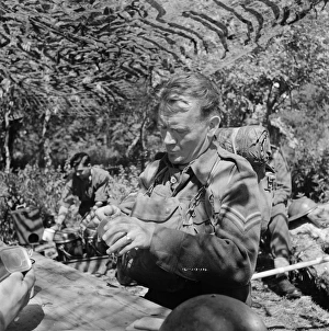 A medium close up of John Mills