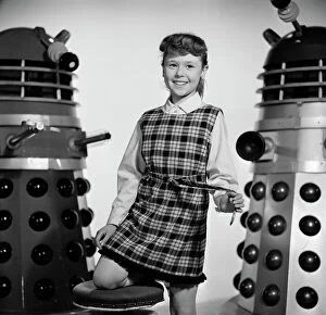 Daleks Collection: A portrait of a smiling Roberta Tovey as Susan with Daleks