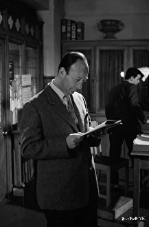<b class=qtipBold><figcaption>On the set of Billy Liar (1963)</figcaption></b><br>Producer Joseph Janni during a pause from filming on the set of the undertaker's office where the main character of Billy Liar (1963) works.<br><em>© Copyright © Studiocanal Films Ltd</em> On the set of Billy Liar (1963)