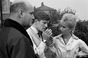 <b class=qtipBold><figcaption>On the set of Billy Liar (1963)</figcaption></b><br>Director John Schlesinger with actors Tom Courtenay and Gwendolyn Watts during a pause of the filming of Billy Liar based on a novel and play by Keith Waterhouse and Willis Hall.<br><em>© Copyright © Studiocanal Films Ltd</em> On the set of Billy Liar (1963)