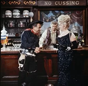 Interiors Collection: Sid James as the Rumpo Kind, Percy Herbert and Joan Sims in a scene from Carry On Jack