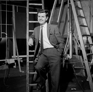 A smiling Rodney Bewes on the set of Billy Liar (1963)